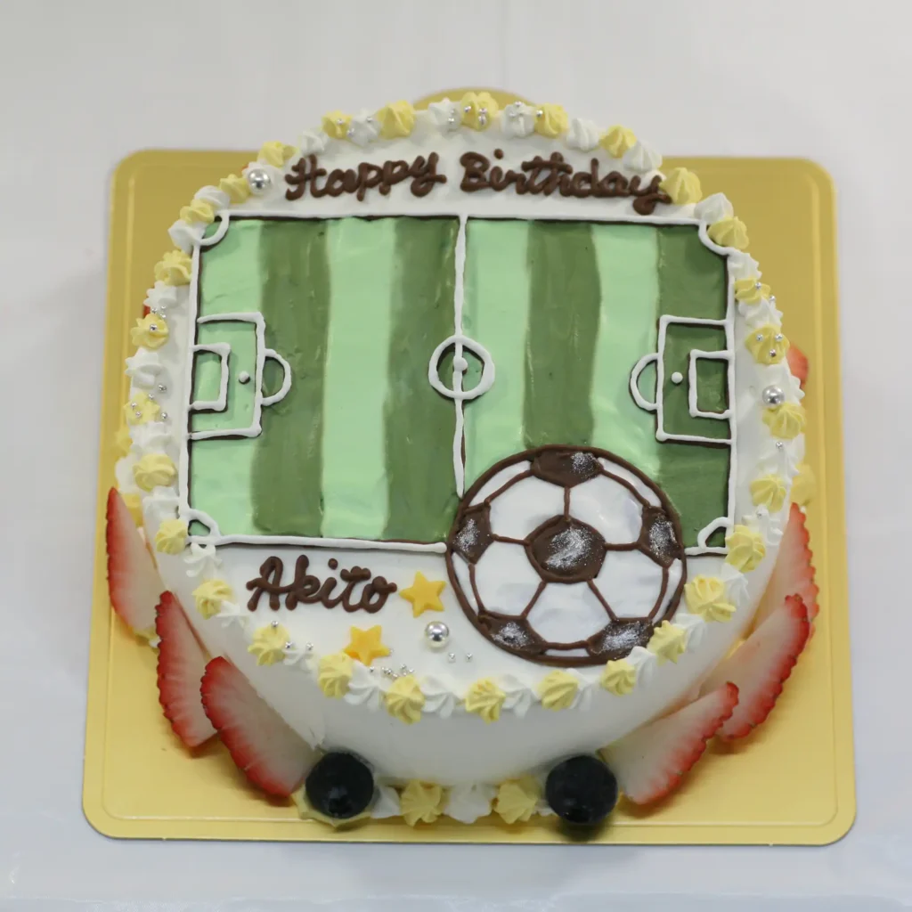 サッカーコートのイラストケーキ